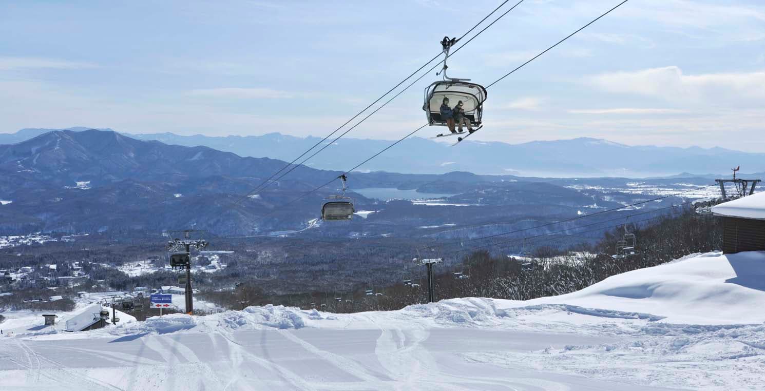Ikenotaira Onsen in Japan - a ski lift going up the mountain.
