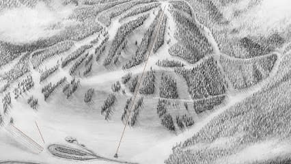 A skier enjoying their time at the ski resort in Cloudcroft New Mexico. The resort is complete with a ski lift providing an exciting winter sports scene against the backdrop of a majestic mountain.
