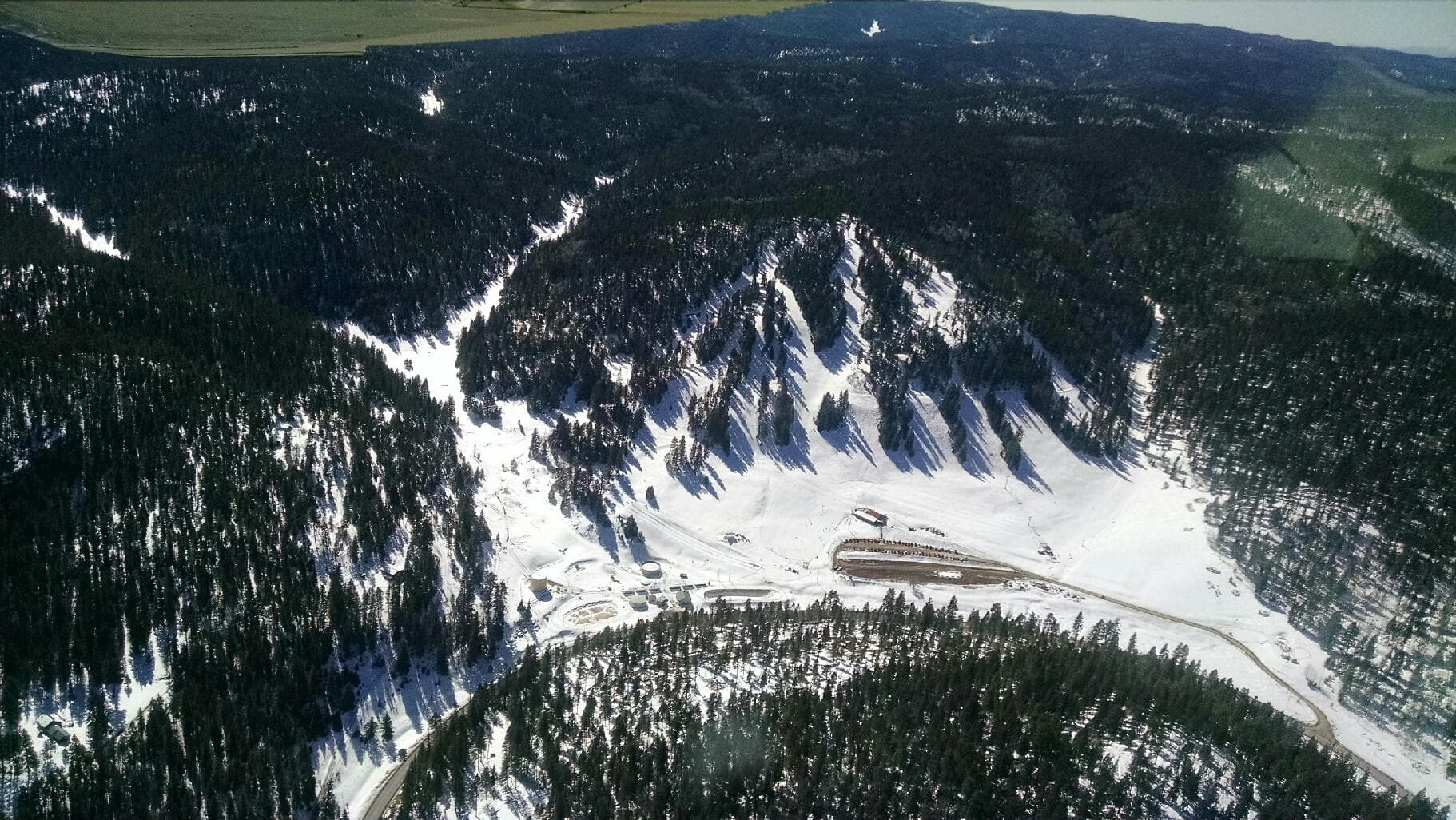 Cloudcroft in USA - an aerial view of a snow covered mountain.