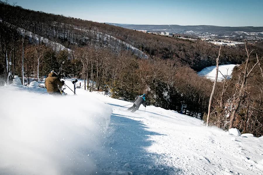 Montage Mountain Resort in USA - a person riding a snowboard down a hill.