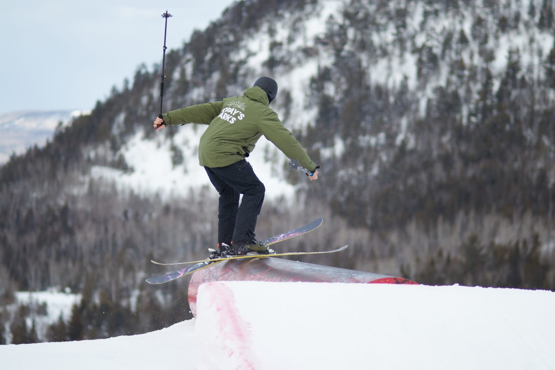 A snowboarder is making his way down a snow-covered slope at Sugarloaf Provincial Park, Atholville, New Brunswick.