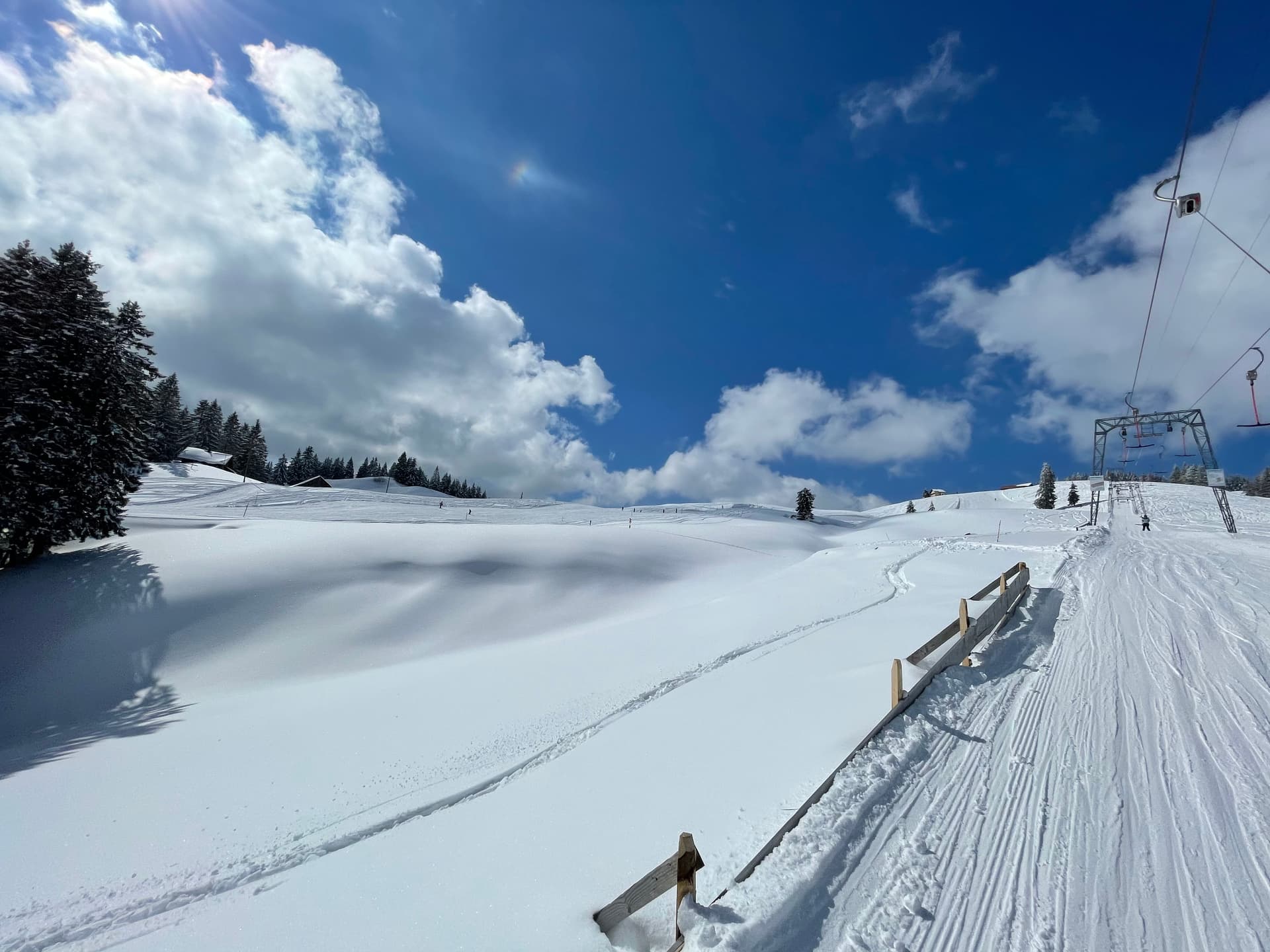 A winter sports scene at the Brunni-Bahnen ski resort in Engelberg-Titlis Switzerland. Featuring stunning winter scenery with snowy mountains and clear blue skies.