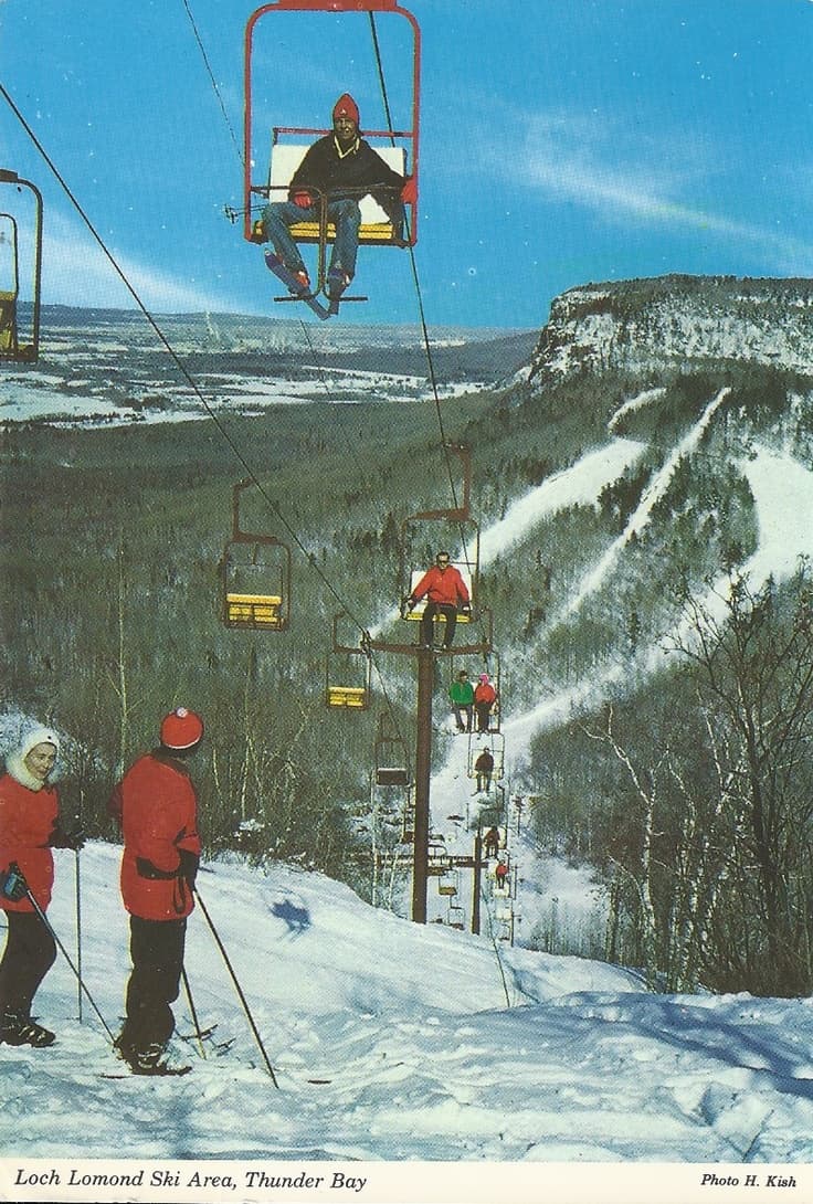 Loch Lomond in Canada - a couple of people riding a ski lift.