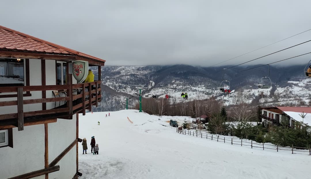 Ski resort in Krasiya, Vyshka, Zakarpattia, Ukraine featuring bustling winter sports scene with a ski lift, amidst stunning winter scenery.