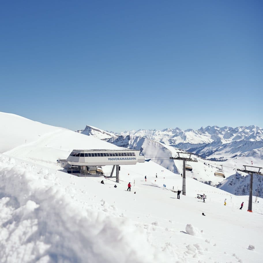 Hochhäderich – Hittisau in Austria - a group of people skiing down a snowy slope.