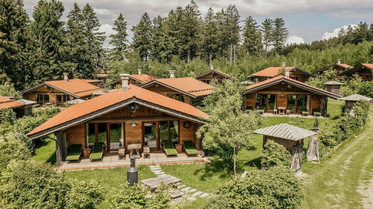 Predigtstuhl Arena in Germany - a group of wooden cabins in the woods.