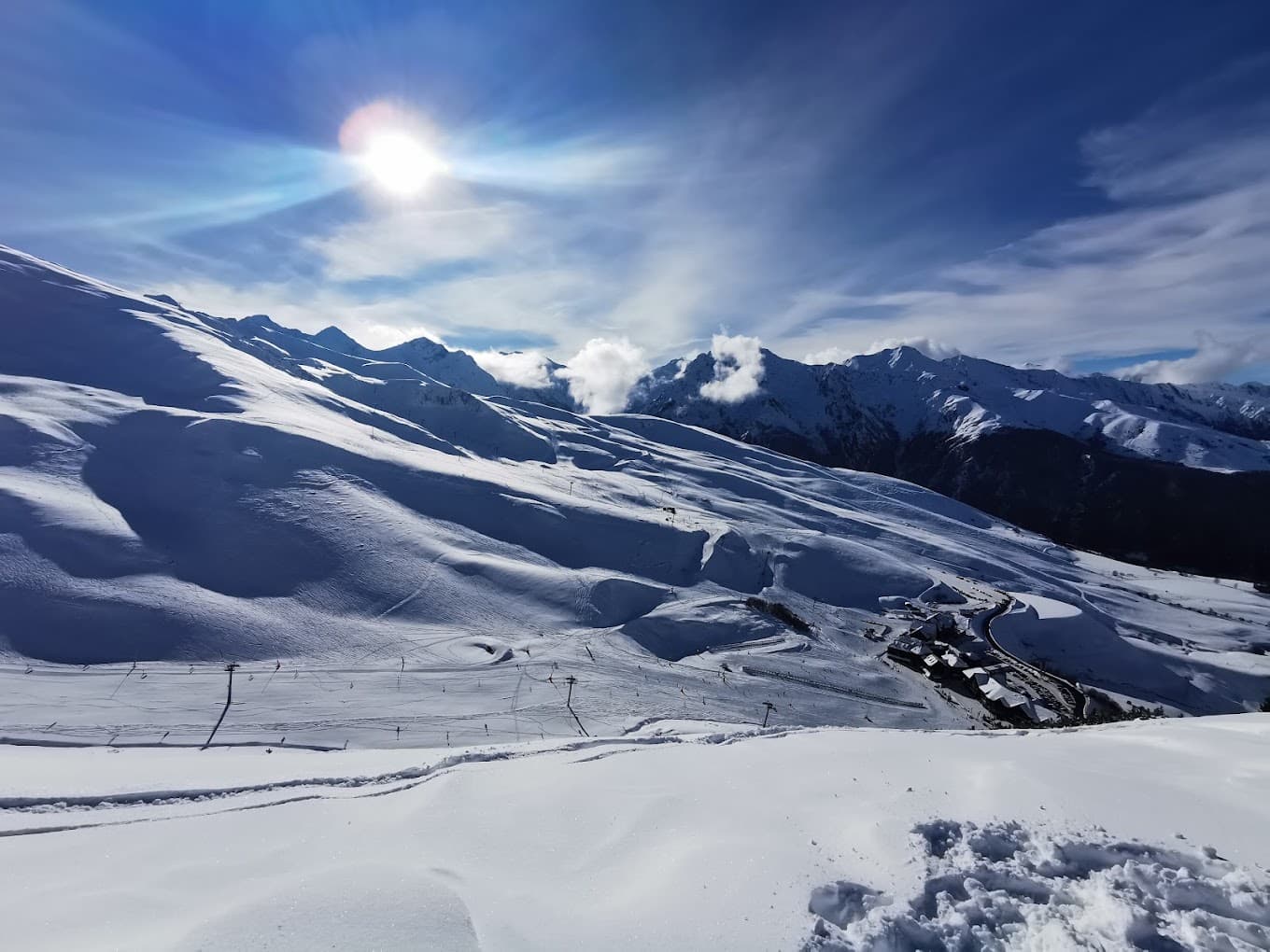 Peyragudes in France - the sun is shining over the snowy mountains.
