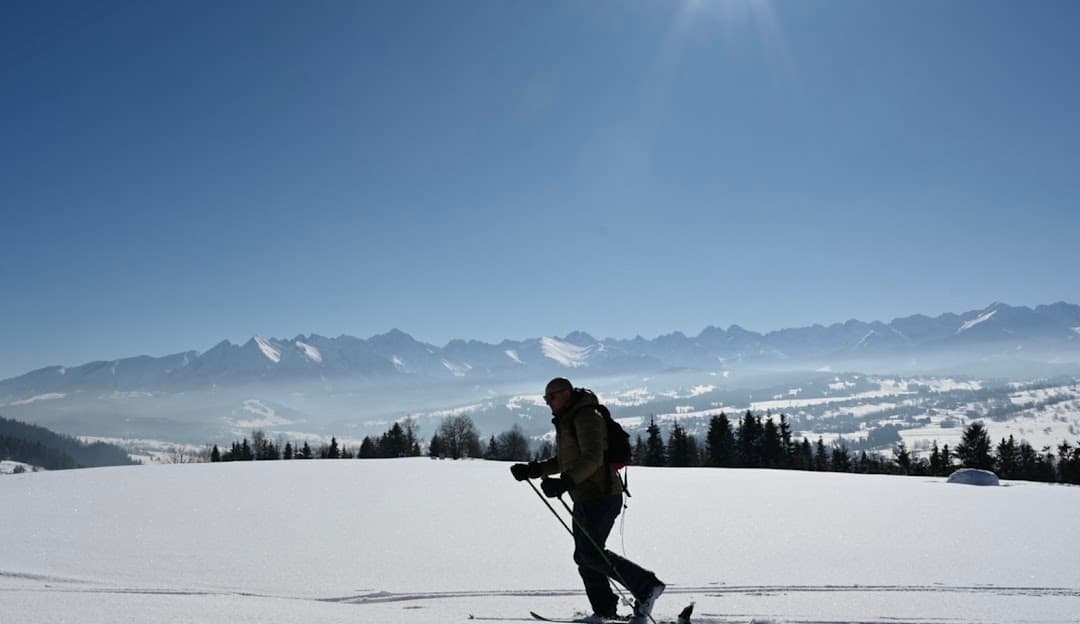 Stacja Narciarska GrapaSki in Poland - a person walking across a snow covered field.