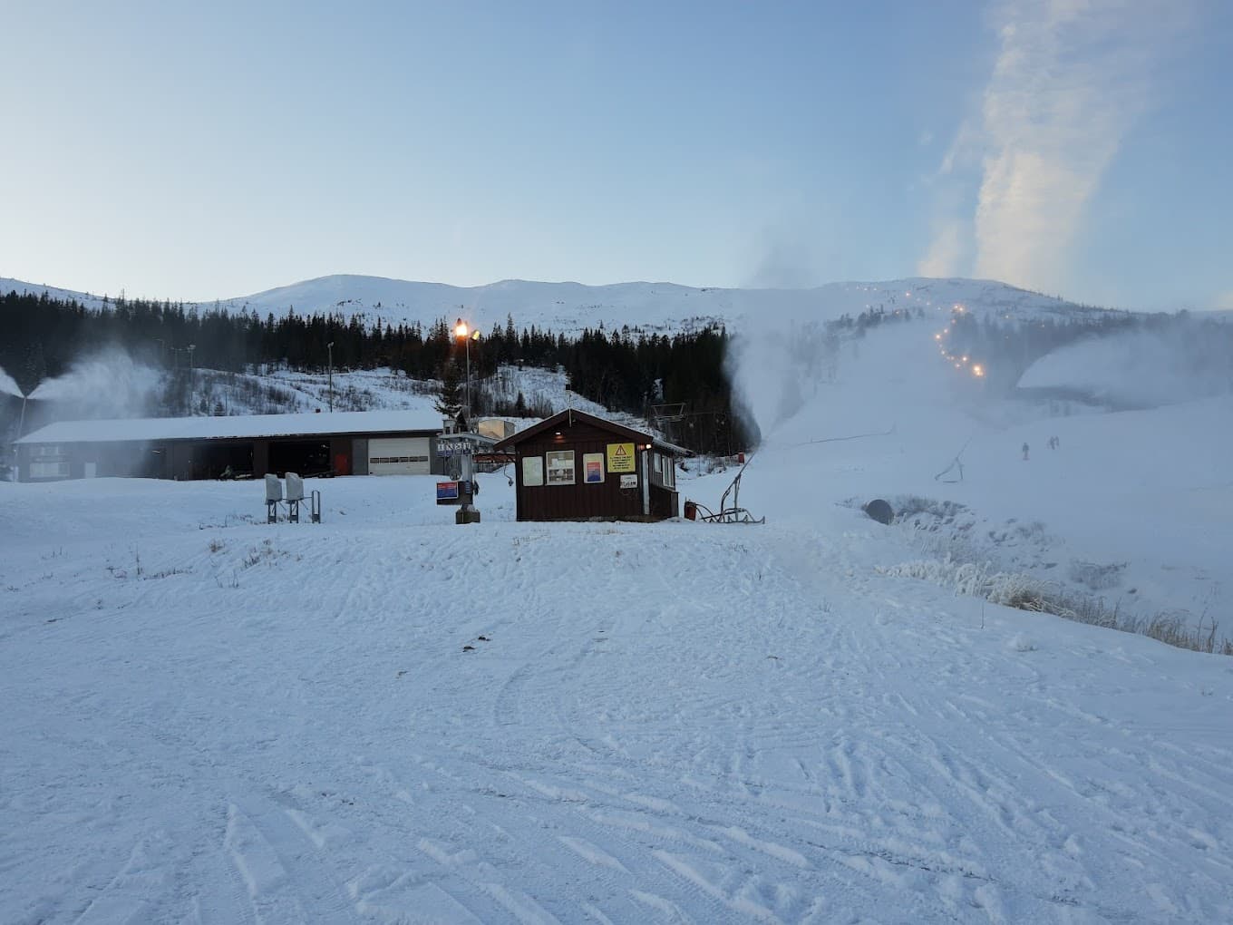 Grong in Norway - a snow covered ski slope with a small cabin in the background.