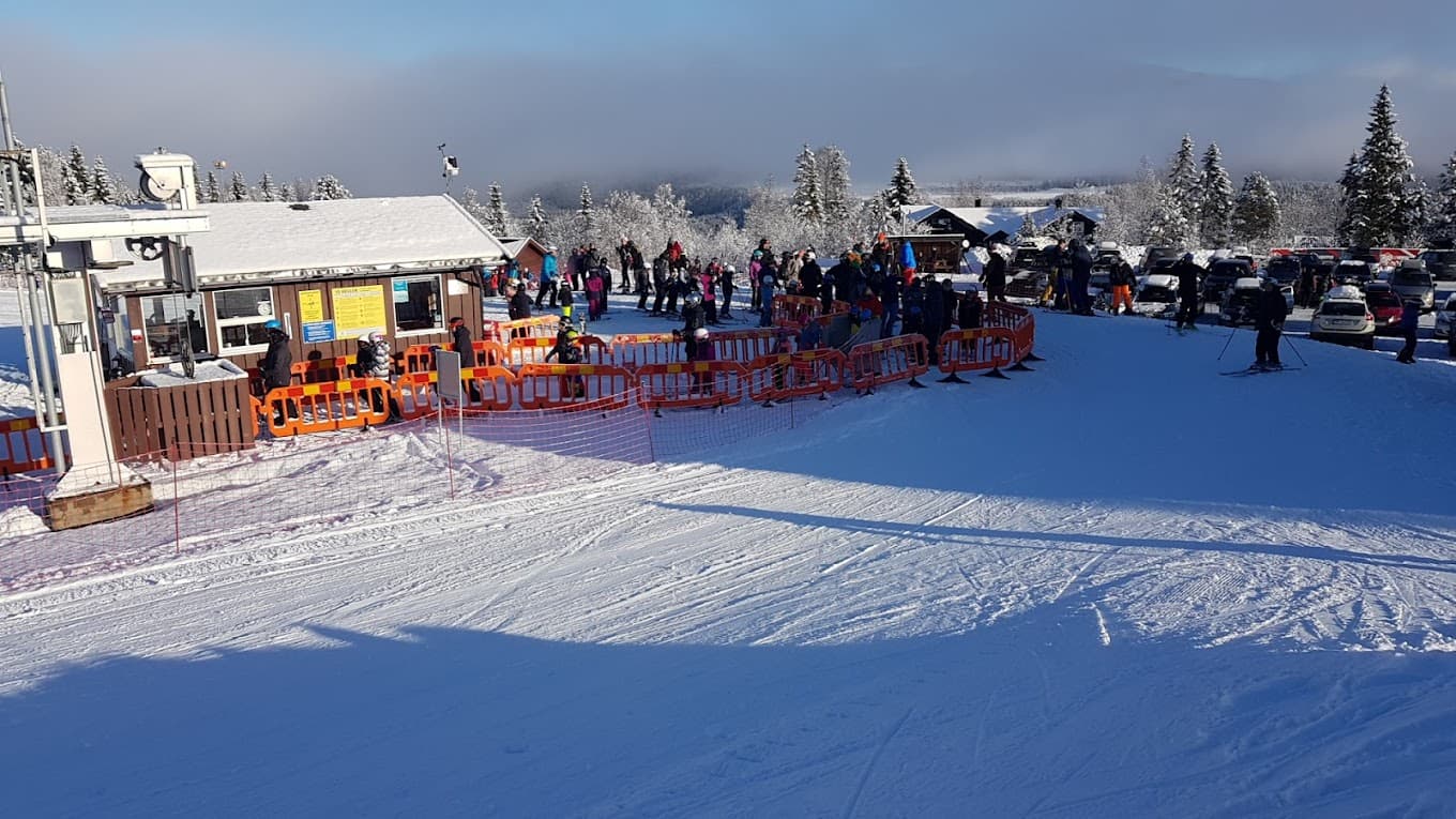 Grong in Norway - a group of people standing on top of a ski slope.