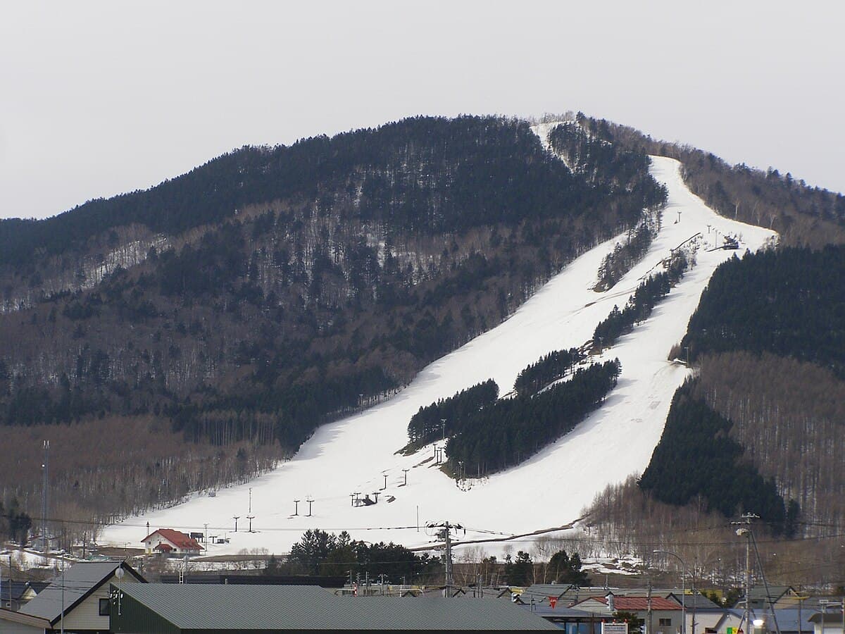 Minami Furano in Japan - a snow covered mountain is in the background.