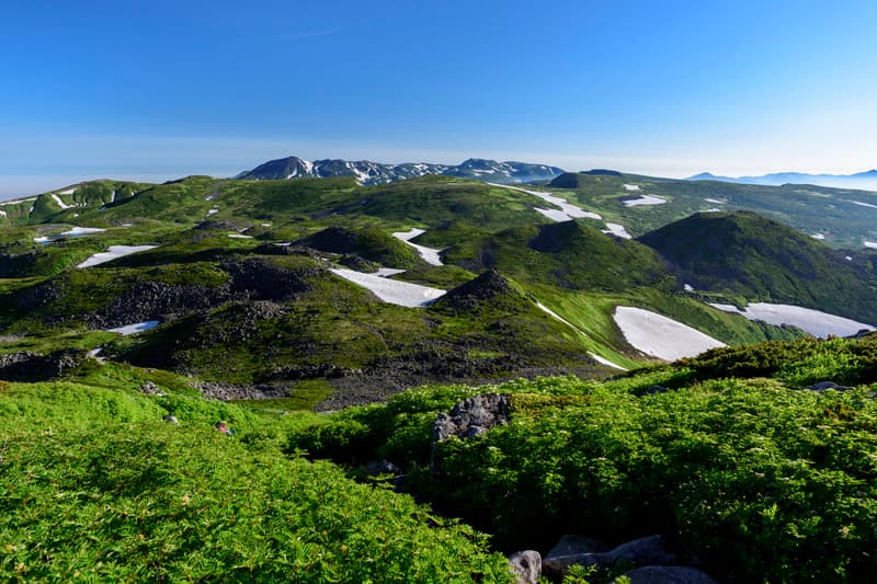 Minami Furano in Japan - a view of the mountains from the top of a mountain.