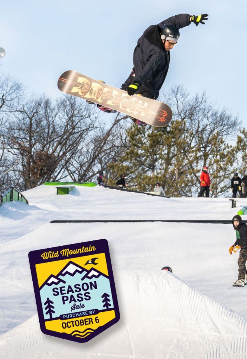 Wild Mountain in USA - a snowboarder doing a trick in the air.