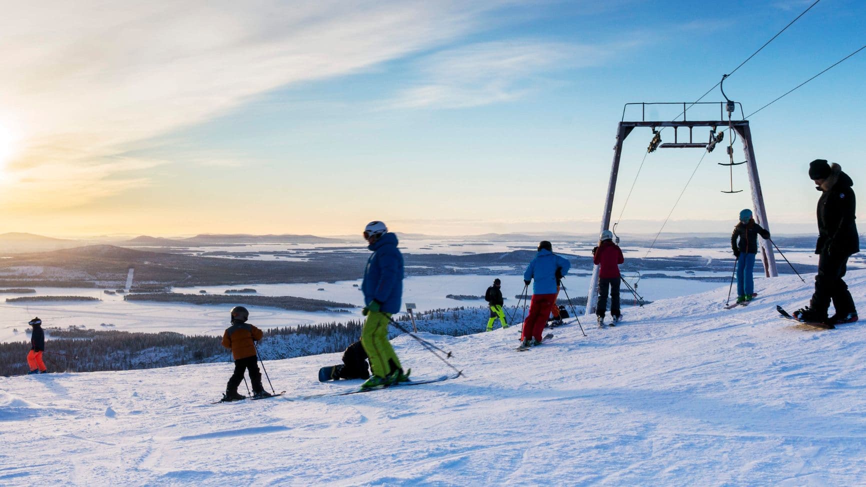 Galtis – Arjeplog in Sweden - a group of people skiing down a mountain.
