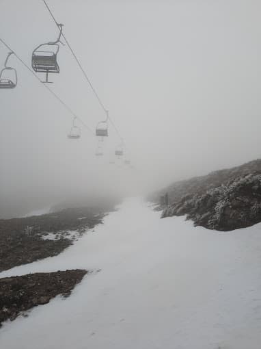 Bruncu Spina in Italy - a ski lift going up a snowy mountain.