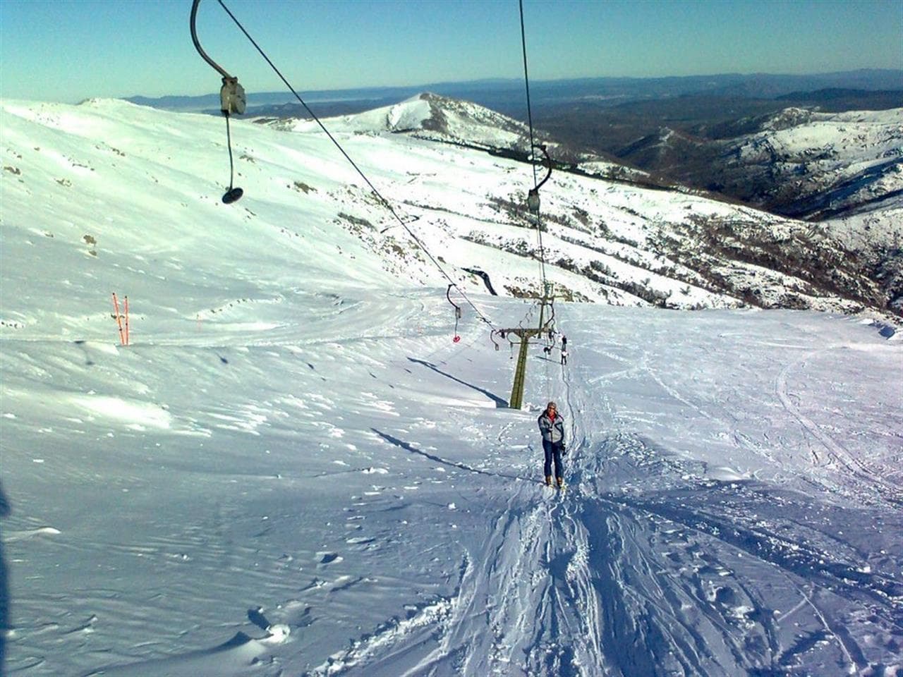 Bruncu Spina in Italy - a person riding a ski board down a snowy slope.