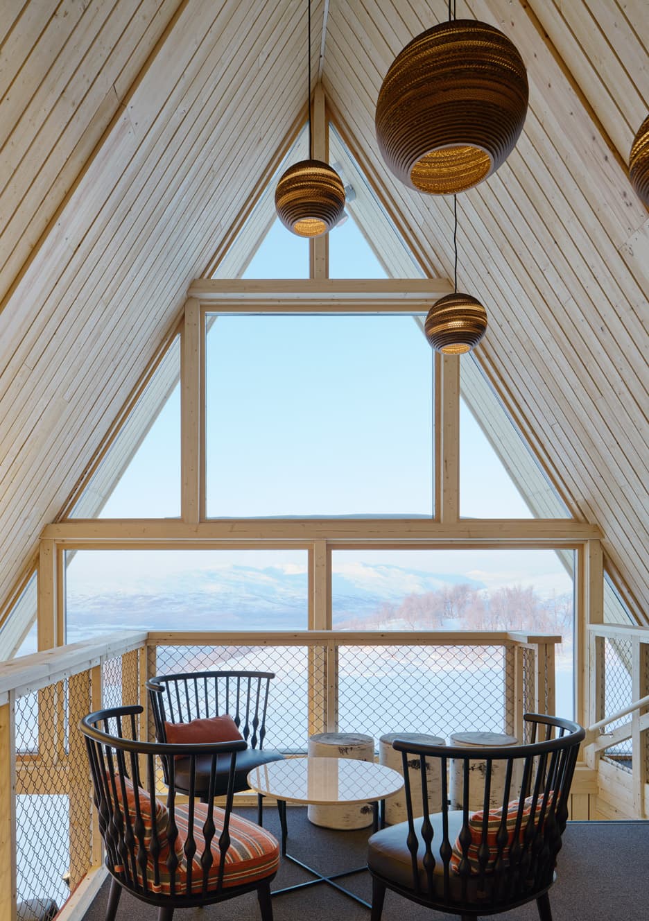 Hemavan in Sweden - two chairs in a room with a view of mountains.