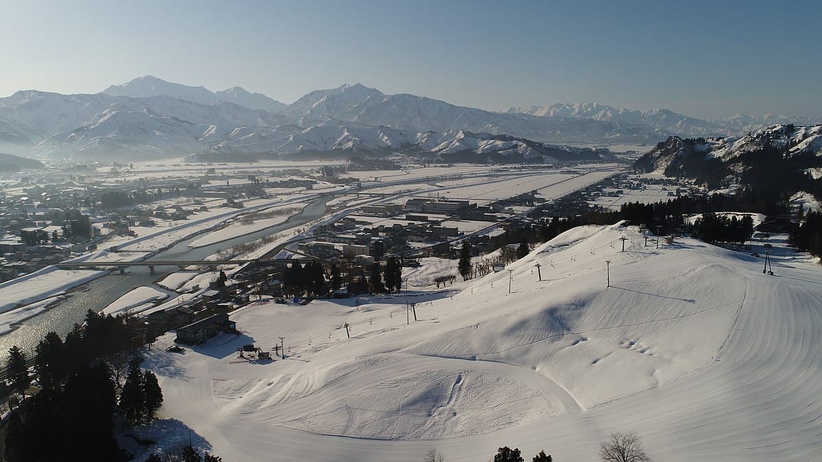 Koide in Japan - a view from the top of a snowy mountain.