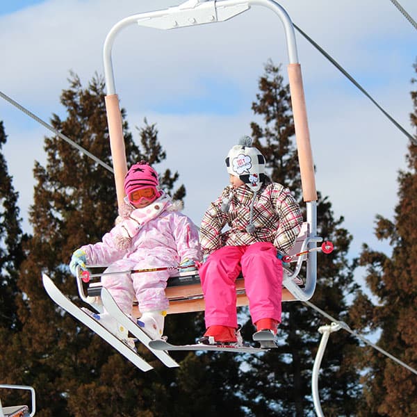 Uenono in Japan - two children sitting on a ski lift.