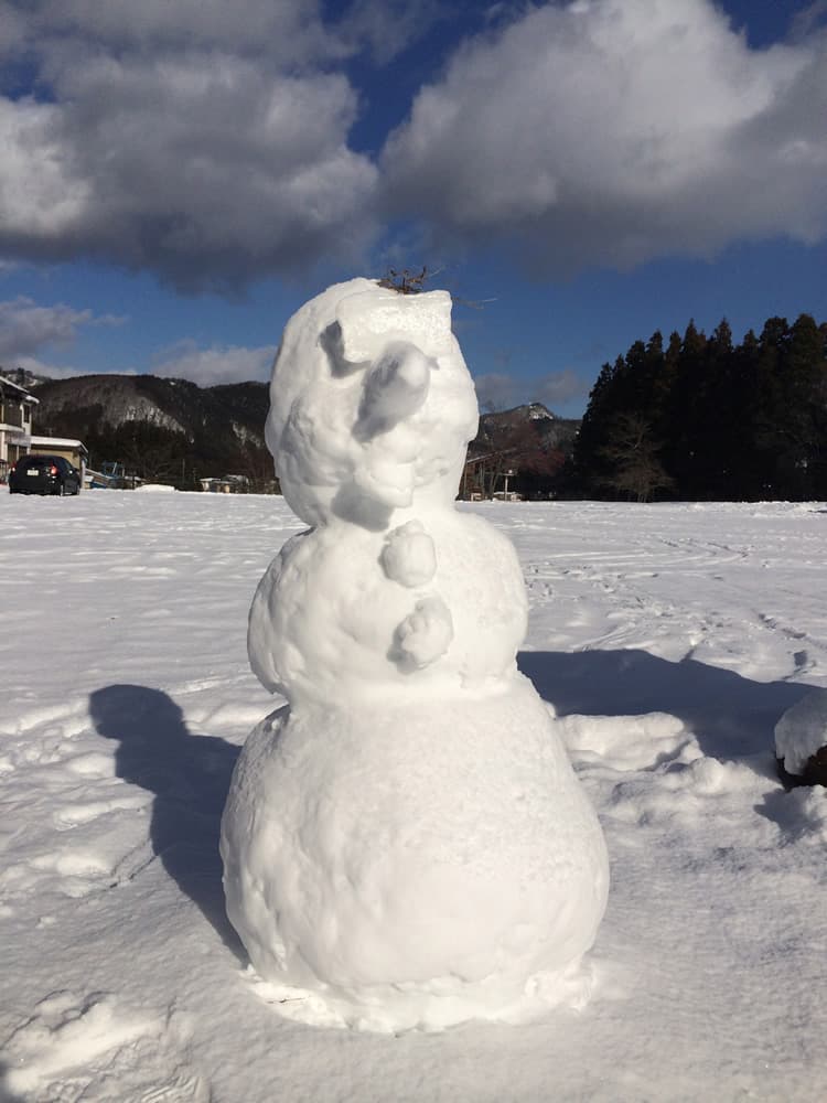 Uenono in Japan - a snowman is sitting in the snow.