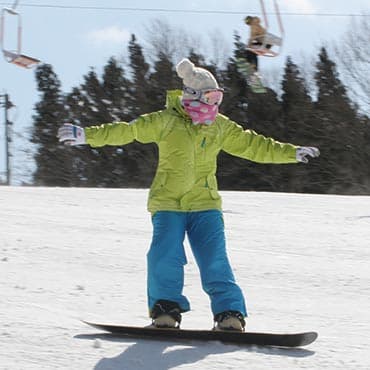 Uenono in Japan - a person on a snowboard in the snow.
