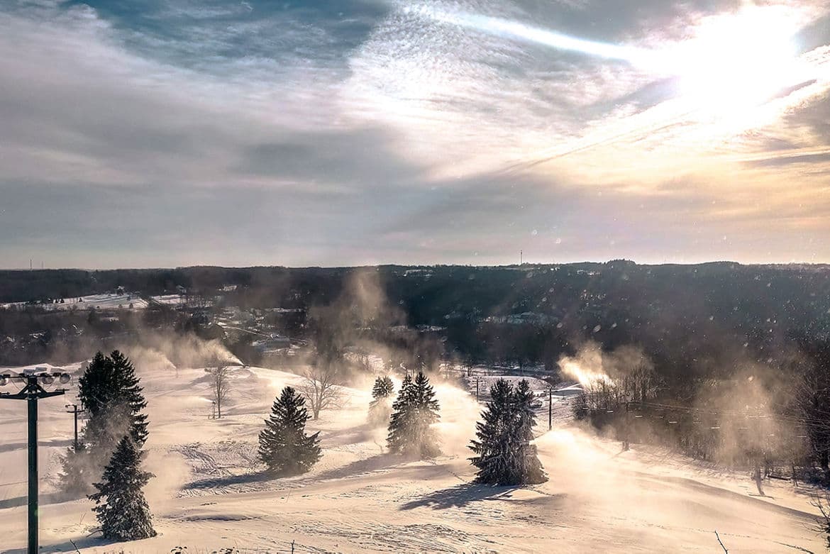 Alpine Valley Ohio in USA - a ski slope covered in snow with trees in the background.