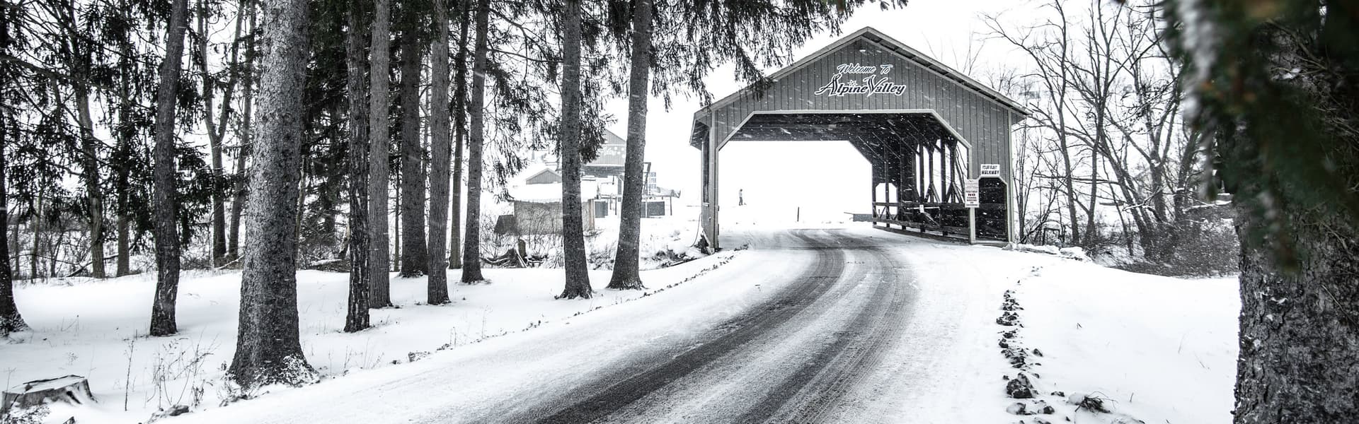Alpine Valley Ohio in USA - an old covered bridge in the winter.