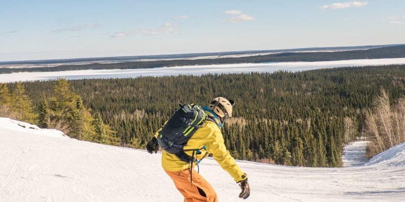 Mystery Mountain in Canada - a person on a snowboard going down a hill.