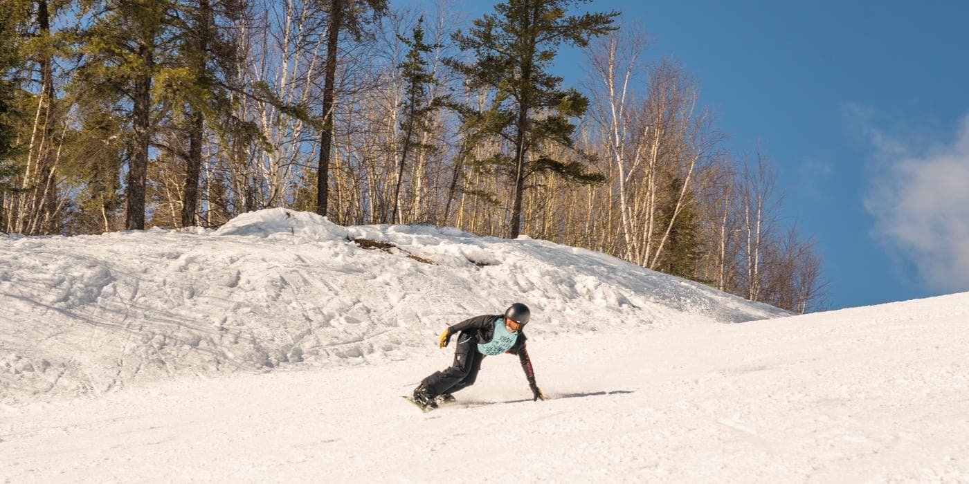 Mystery Mountain in Canada - a person on a snowboard going down a hill.