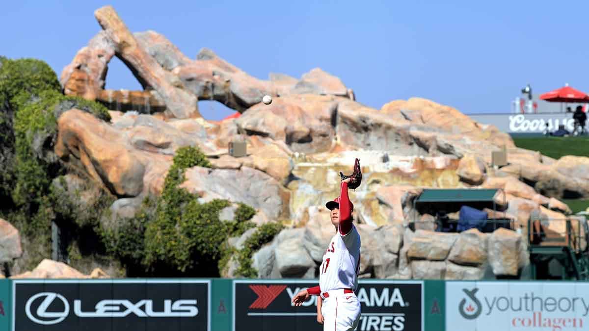 Asahi in Japan - a baseball player throwing a ball in the air.