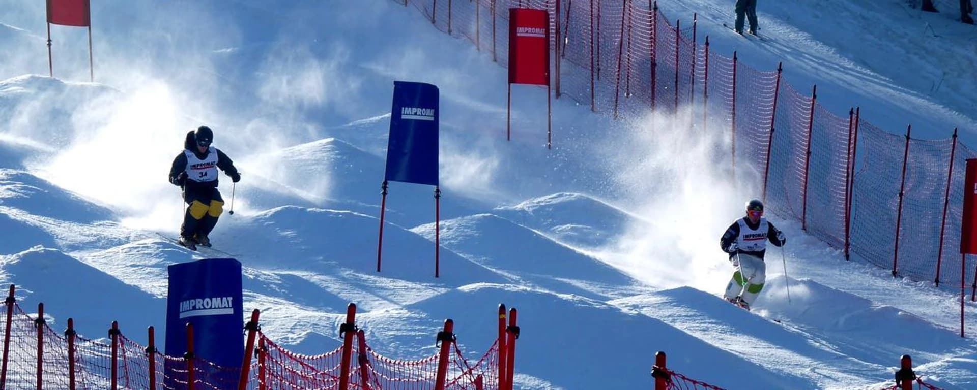 Ski resort Mariánky in Czech Republic - two skiers are racing down a snowy slope.