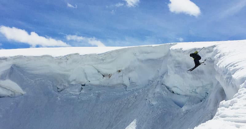 Beartooth Basin in USA - a person on a snowboard in the snow.