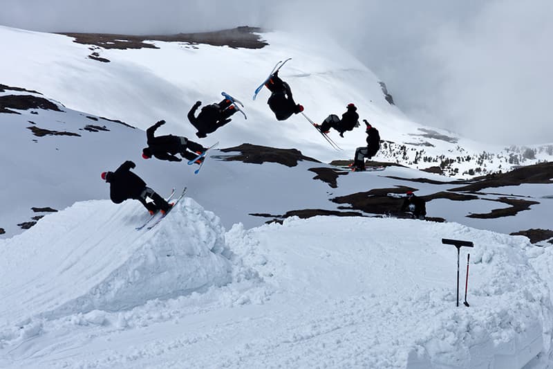 Beartooth Basin in USA - a group of people skiing down a snow covered mountain.