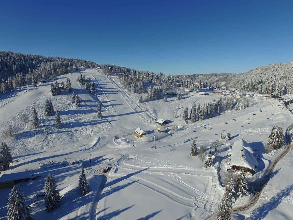 Muggenbrunn in Germany: an aerial view of a ski resort in the mountains.