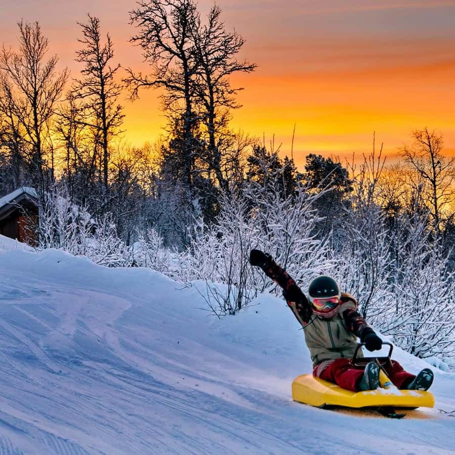 Dagali Fjellpark in Norway - a person on a snowboard in the snow.