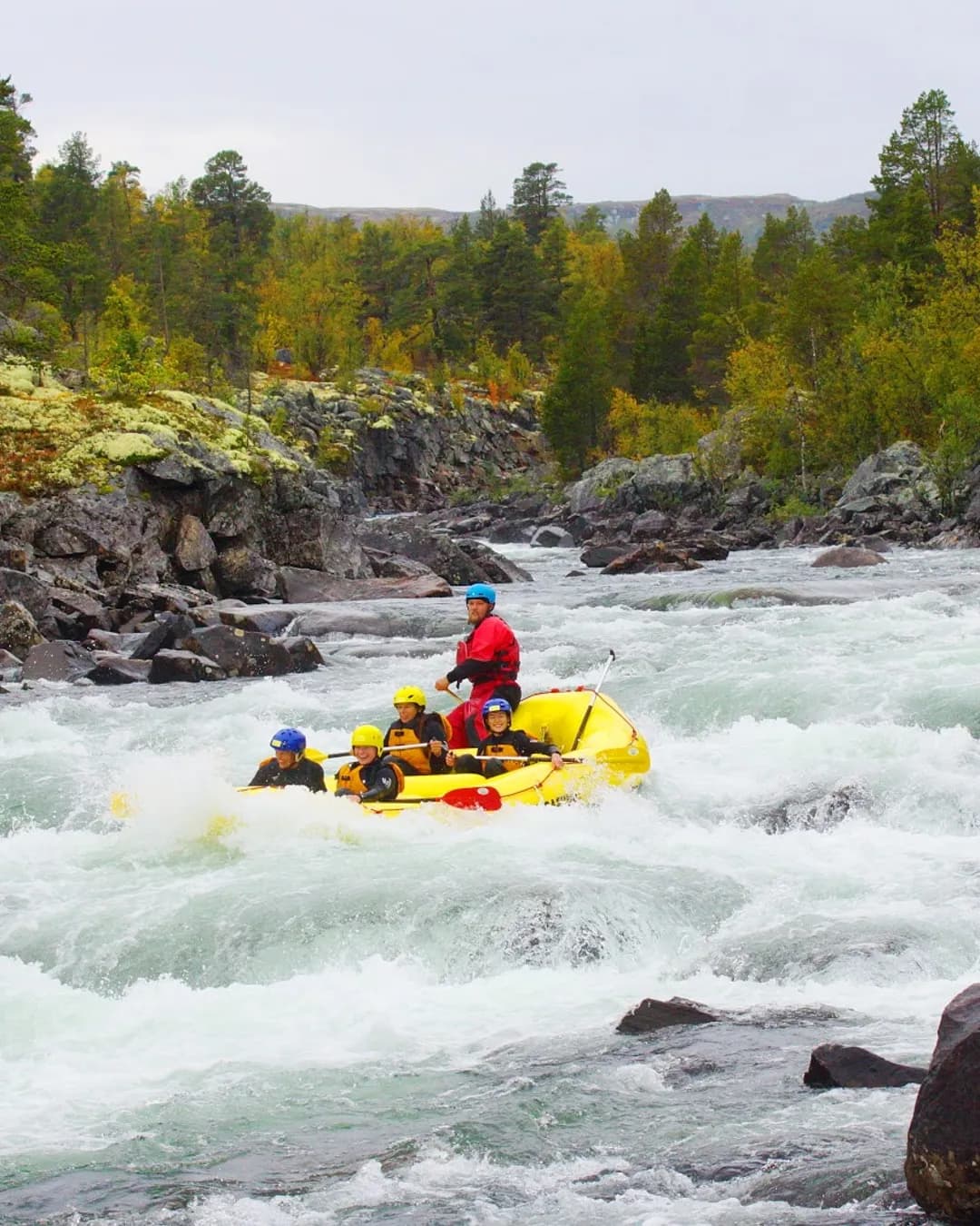 Dagali Fjellpark in Norway - a man in a yellow raft on a river.