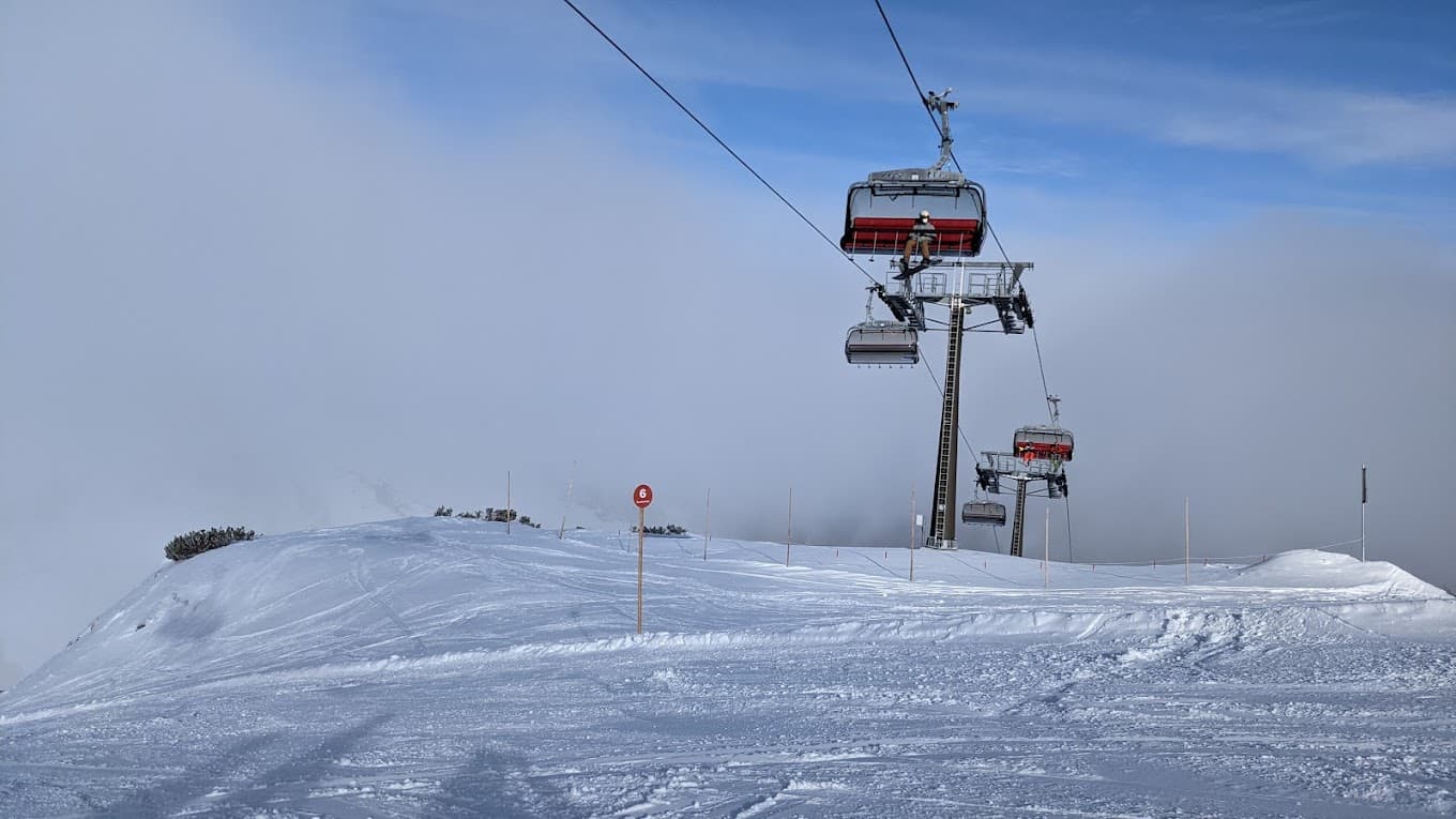 Salzbuger Sportwelt -Amade in Austria - a ski lift going up a snowy hill.