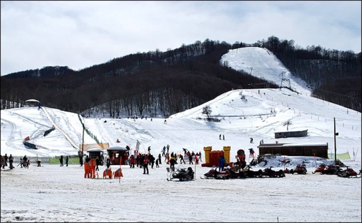 Karakoli in Greece - a group of people that are standing in the snow.