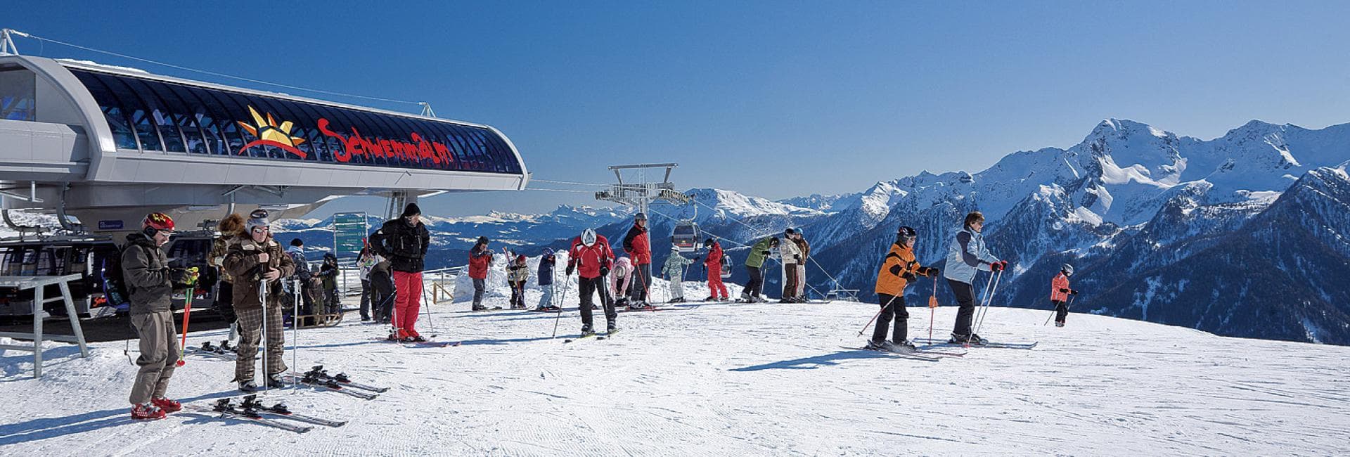 Schwemmalm in Italy - a group of people standing on top of a mountain.