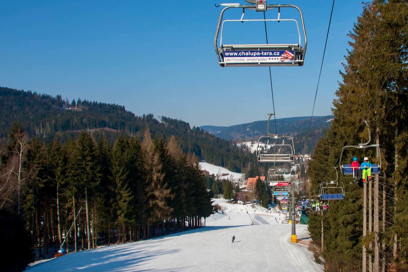 Ski areál U Čápa in Czech Republic - a ski lift going up a snowy slope.