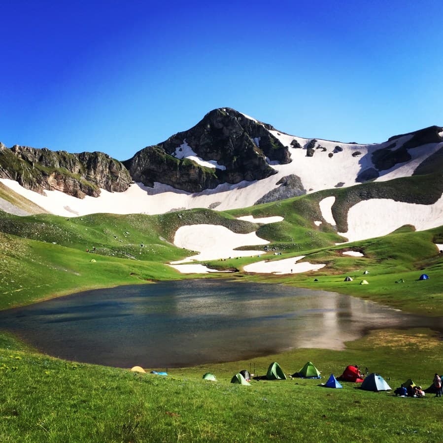 Lailia in Greece - a group of people are camping in the mountains.