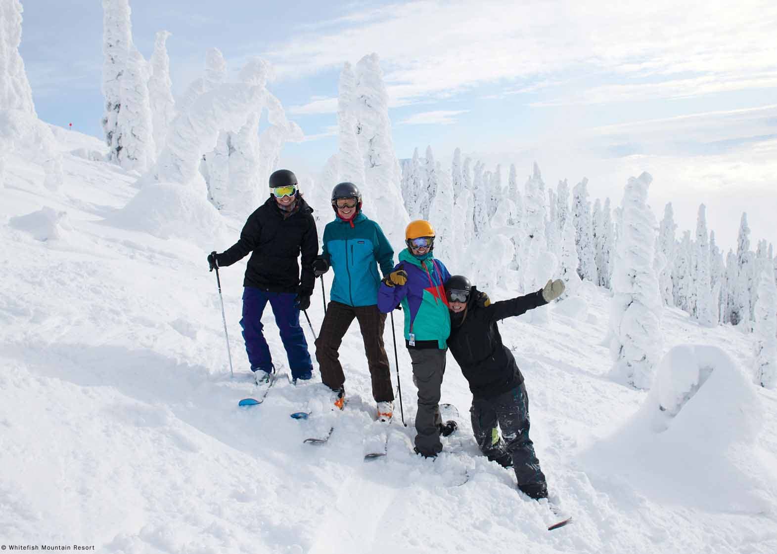 Whitefish Mountain Resort in USA - a group of people skiing down a snowy hill.