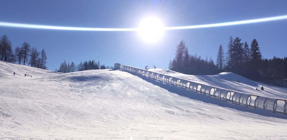 Birkenlift in Austria - the sun is shining over the snow covered slopes.