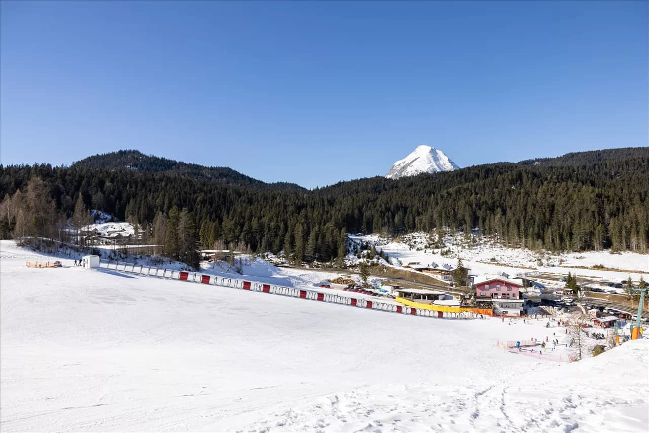 Birkenlift in Austria: a view of a ski resort with mountains in the background.
