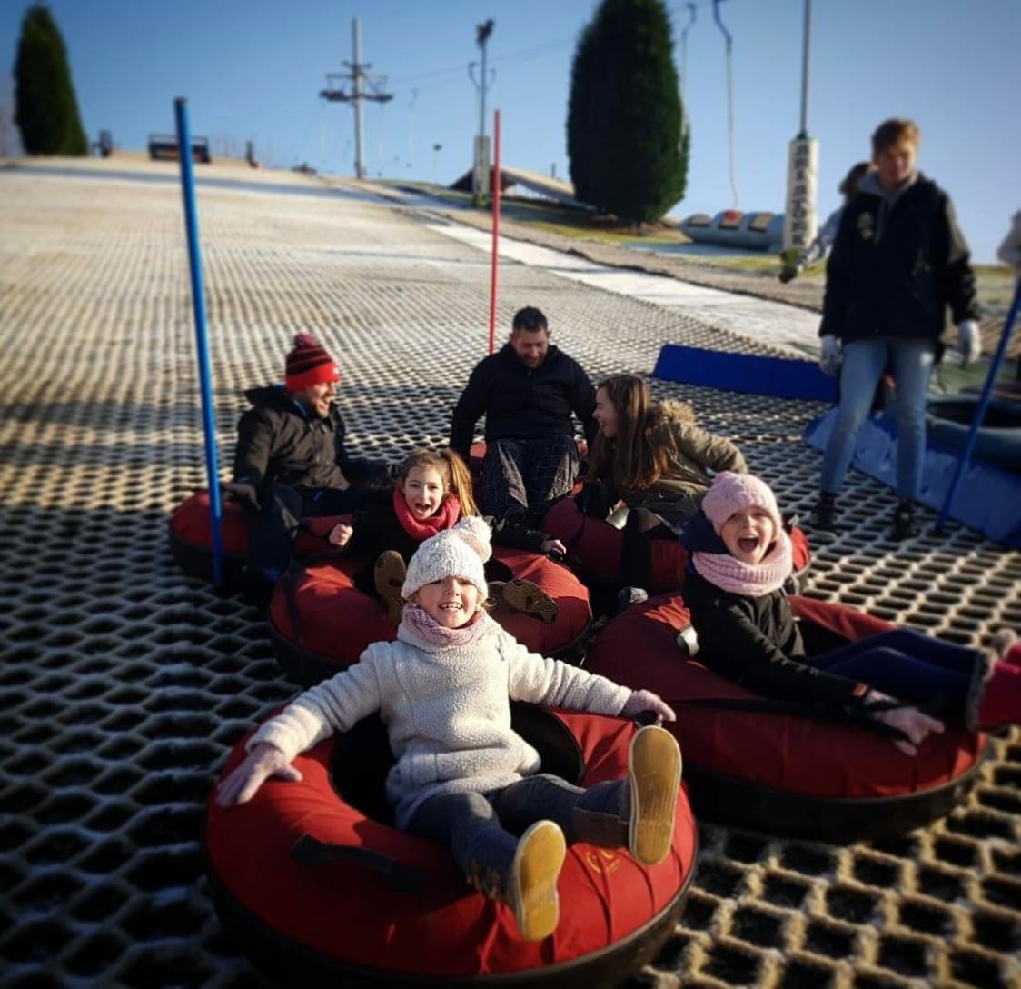 Stoke Ski Centre in United Kingdom - a group of people sitting on top of a red couch.