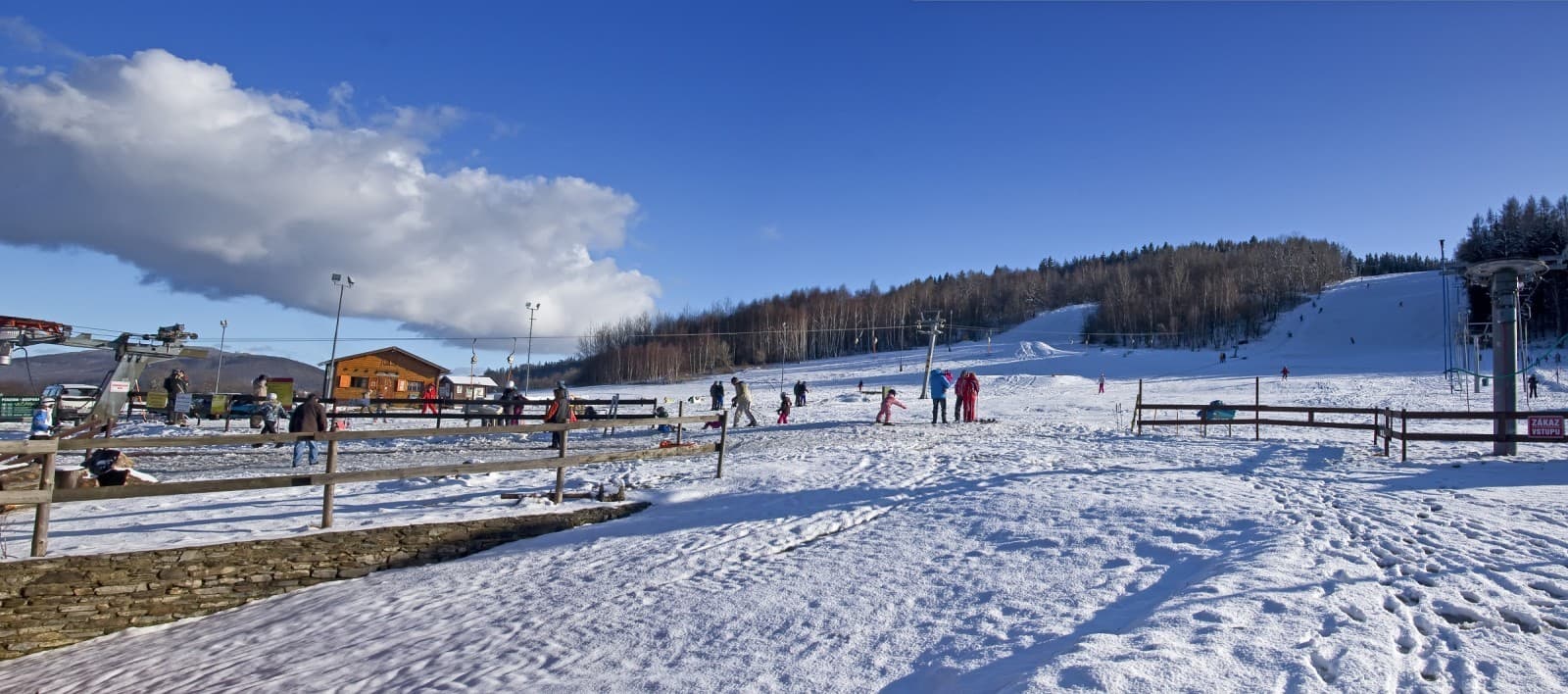 Soláň – Bzové in Czech Republic - a snow covered ski slope with people on it.