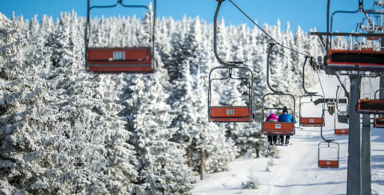 Kvasejovice in Czech Republic - a ski lift going up a snowy slope.