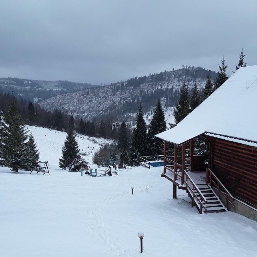 Oryavchik in Ukraine - a snow covered ski slope with a cabin in the background.