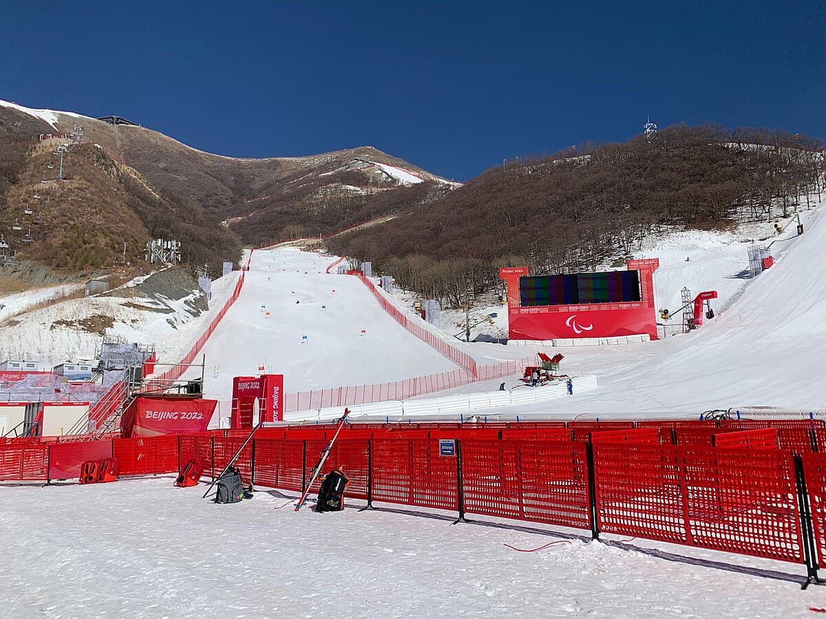 Yanqing National Alpine Ski Centre in China - a red fence in the snow.