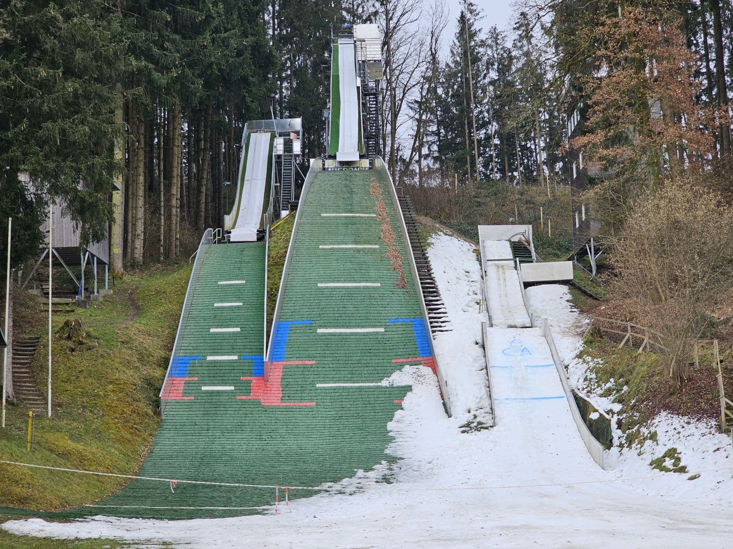Wartenberg in Germany - a ski slope covered in snow next to trees.